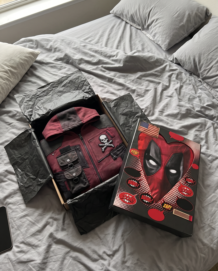 Open box with the hoodie folded inside